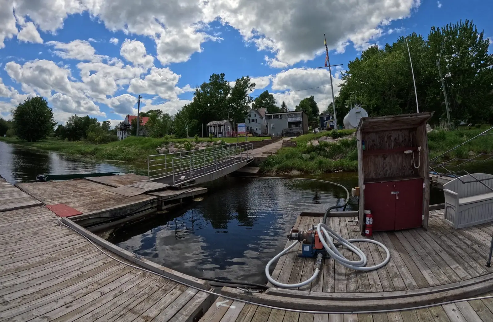 On the docks at Gagetown Marina, the village rooflines beyond